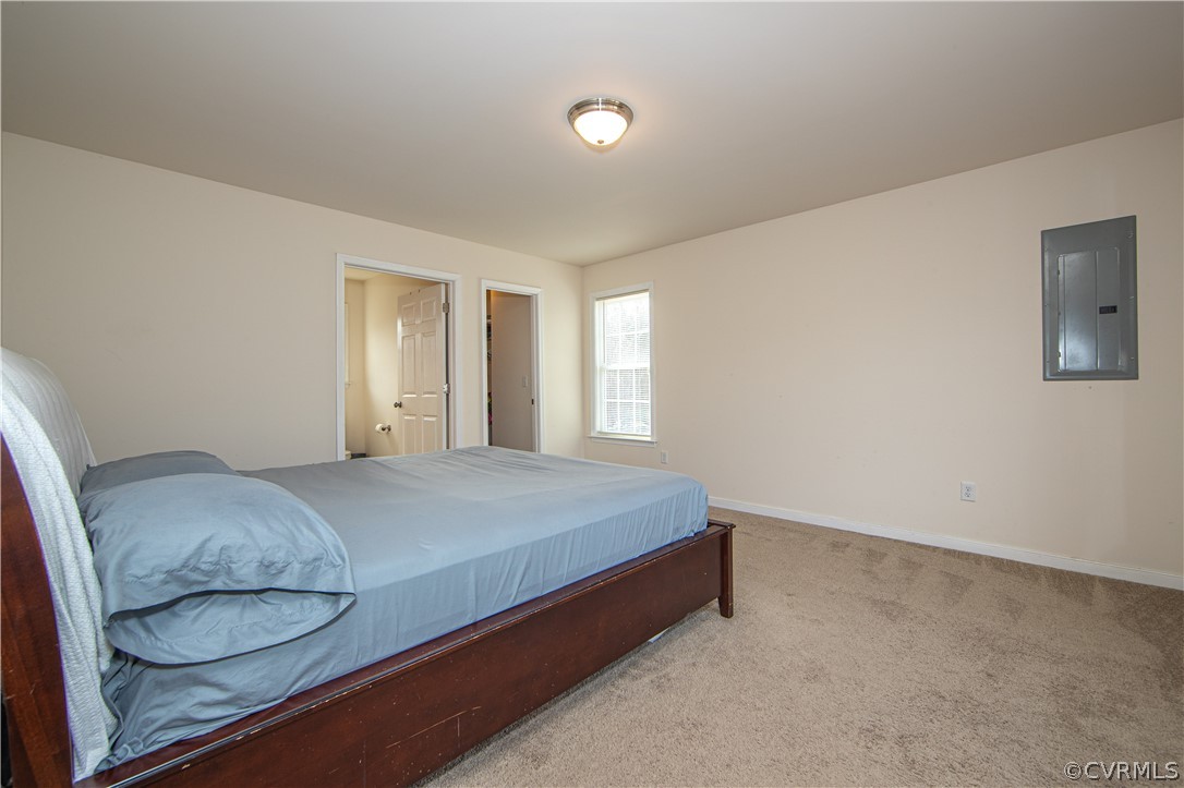 18951 Lundys Road Dinwiddie, VA 23841 - Photo 9 of 27 a bedroom with a bed and window