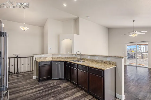 a kitchen with a sink and stove