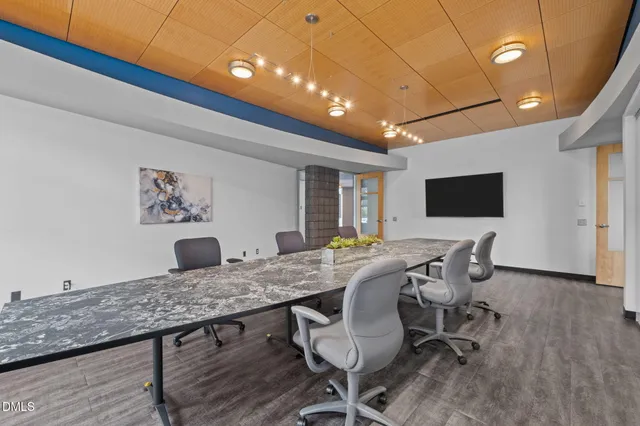 a view of a porch with furniture and a gate