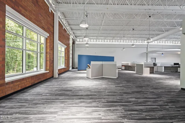 a view of a living room with a large window