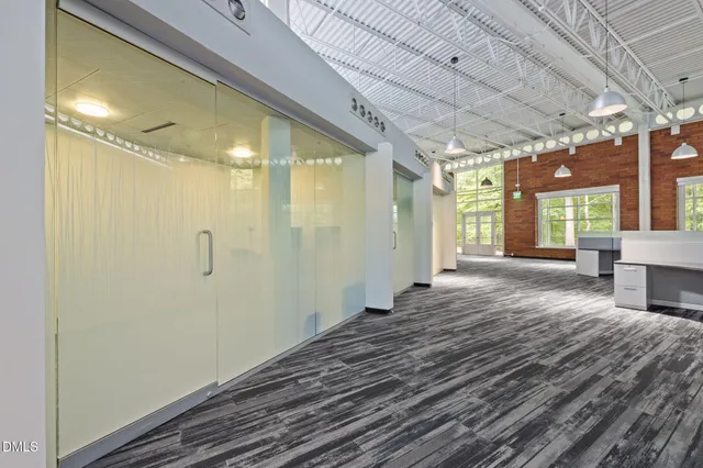 a view of a kitchen with a sink and cabinets