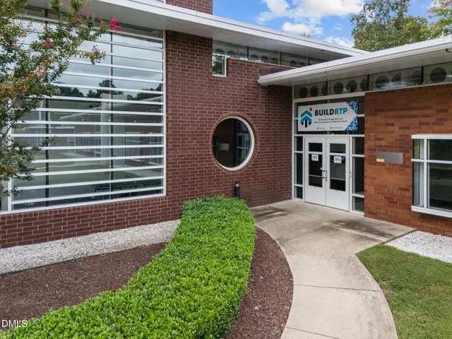 a view of a brick house with a large window