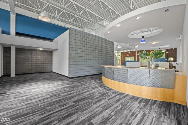 an aerial view of a residential apartment building with a yard