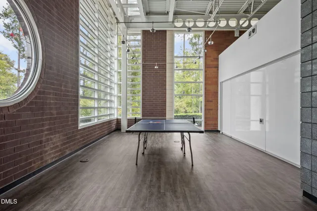 a view of a living room with a wooden floor