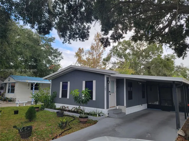 a front view of house with garage and yard