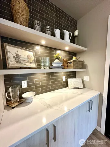 a kitchen with a stove and cabinets
