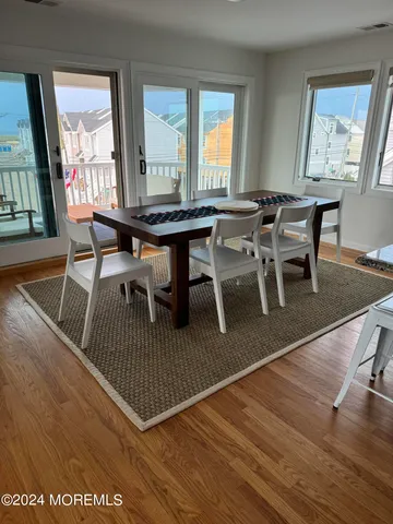 a workspace with furniture window and wooden floor