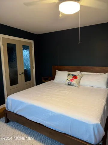 a bedroom with a bed and a lamp