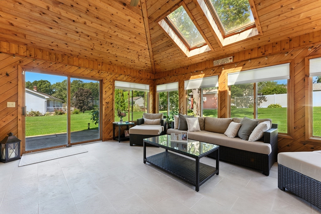 51 Newcrest Street Ludlow, MA 01056 - Photo 12 of 38 a living room with furniture and a garden