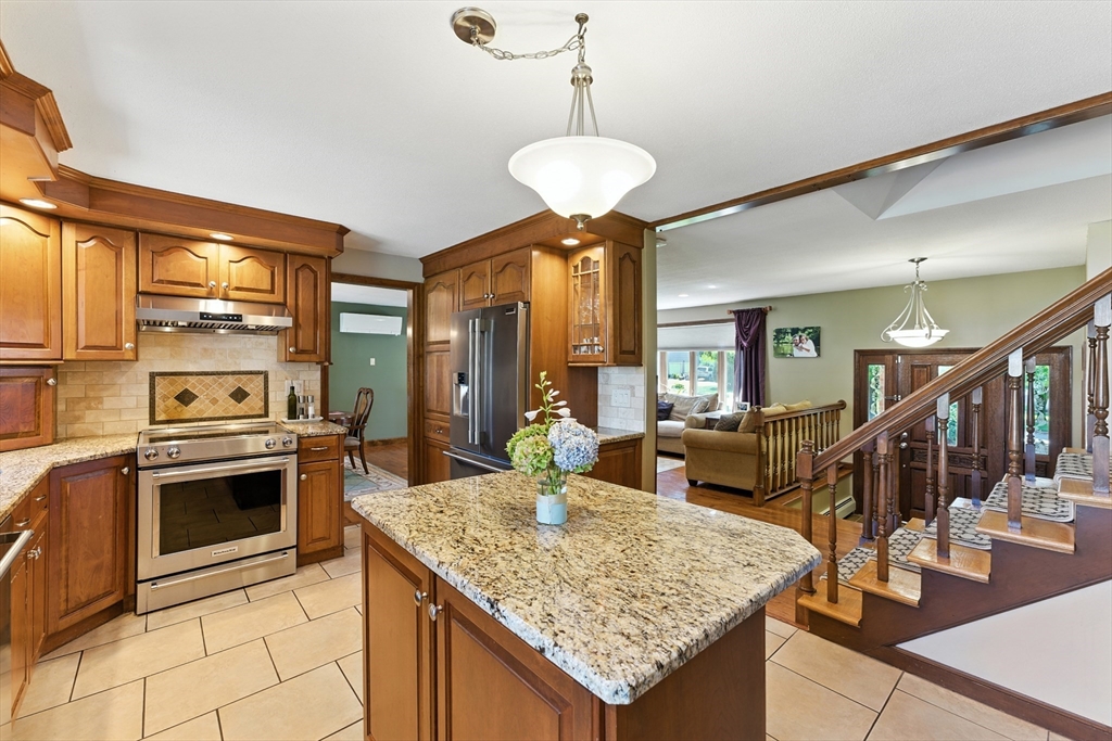 51 Newcrest Street Ludlow, MA 01056 - Photo 15 of 38 a kitchen with stainless steel appliances granite countertop stove and cabinets