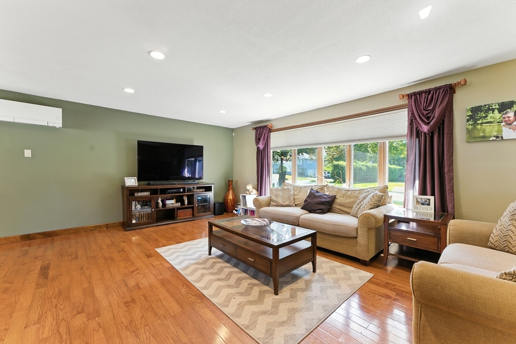 51 Newcrest Street Ludlow, MA 01056 - Photo 20 of 38 a living room with furniture and a flat screen tv