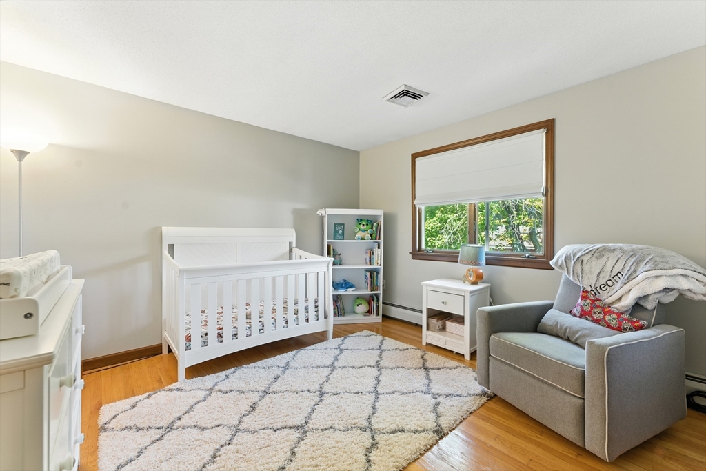51 Newcrest Street Ludlow, MA 01056 - Photo 24 of 38 a bedroom with furniture and a large window