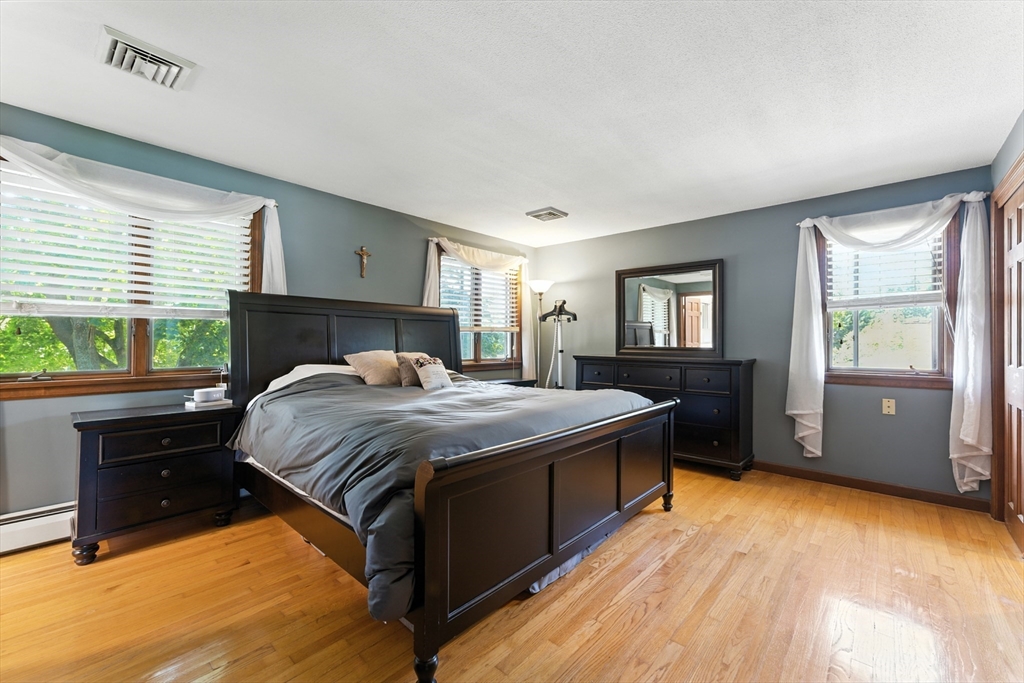 51 Newcrest Street Ludlow, MA 01056 - Photo 26 of 38 a bedroom with a bed and a dresser next to a window