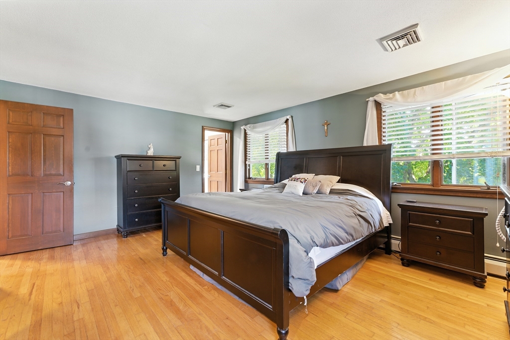 51 Newcrest Street Ludlow, MA 01056 - Photo 27 of 38 a bedroom with a bed and a tv on the dresser