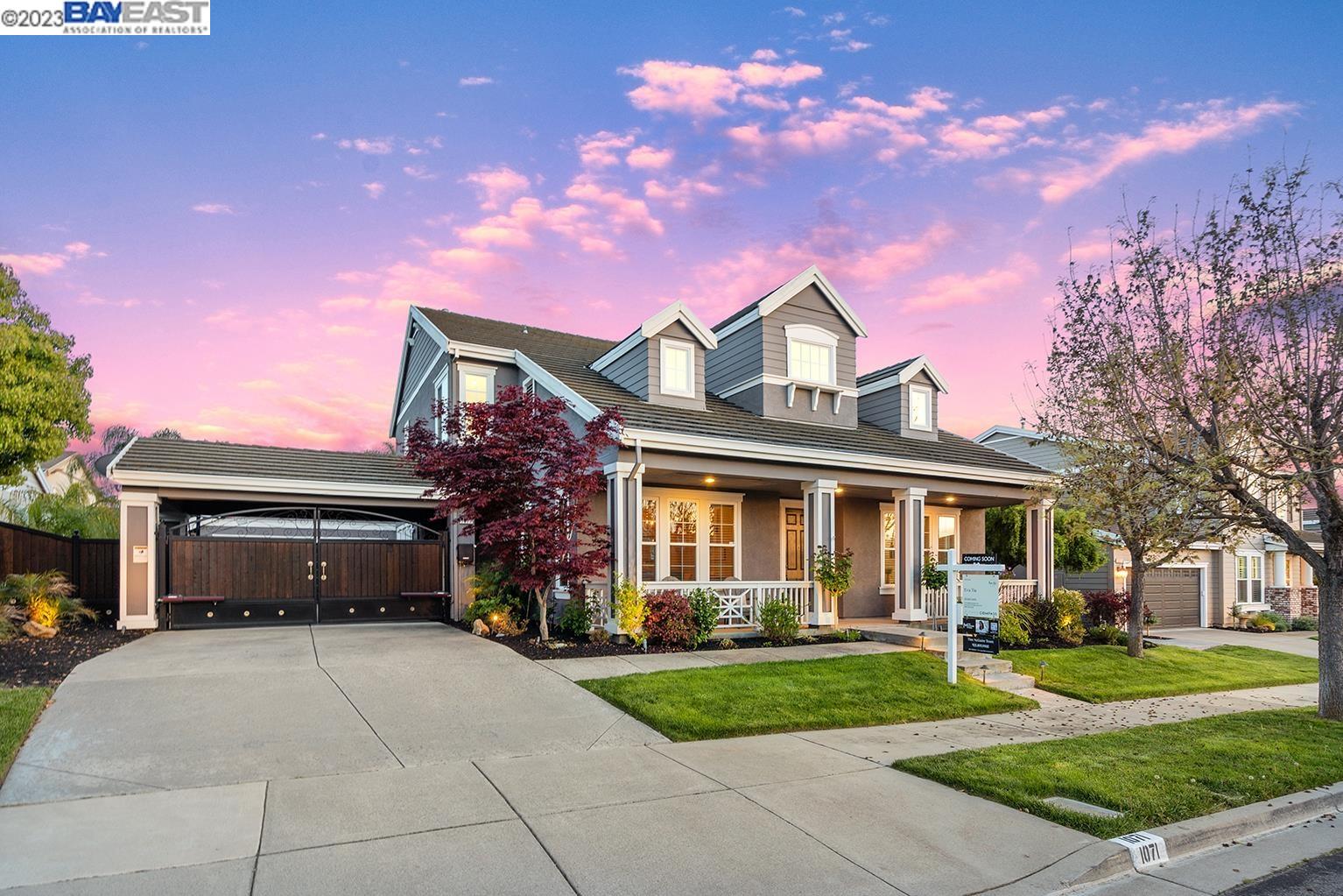 1071 Lexington Way Livermore, CA 94550 - Photo 1 of 1 a front view of a house with a yard and garage