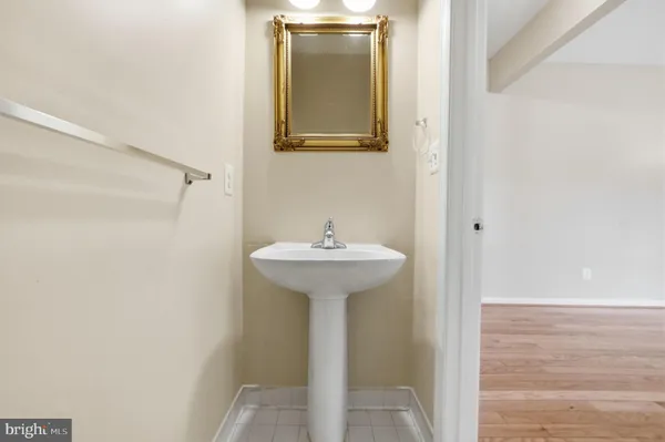 a bathroom with a sink and mirror