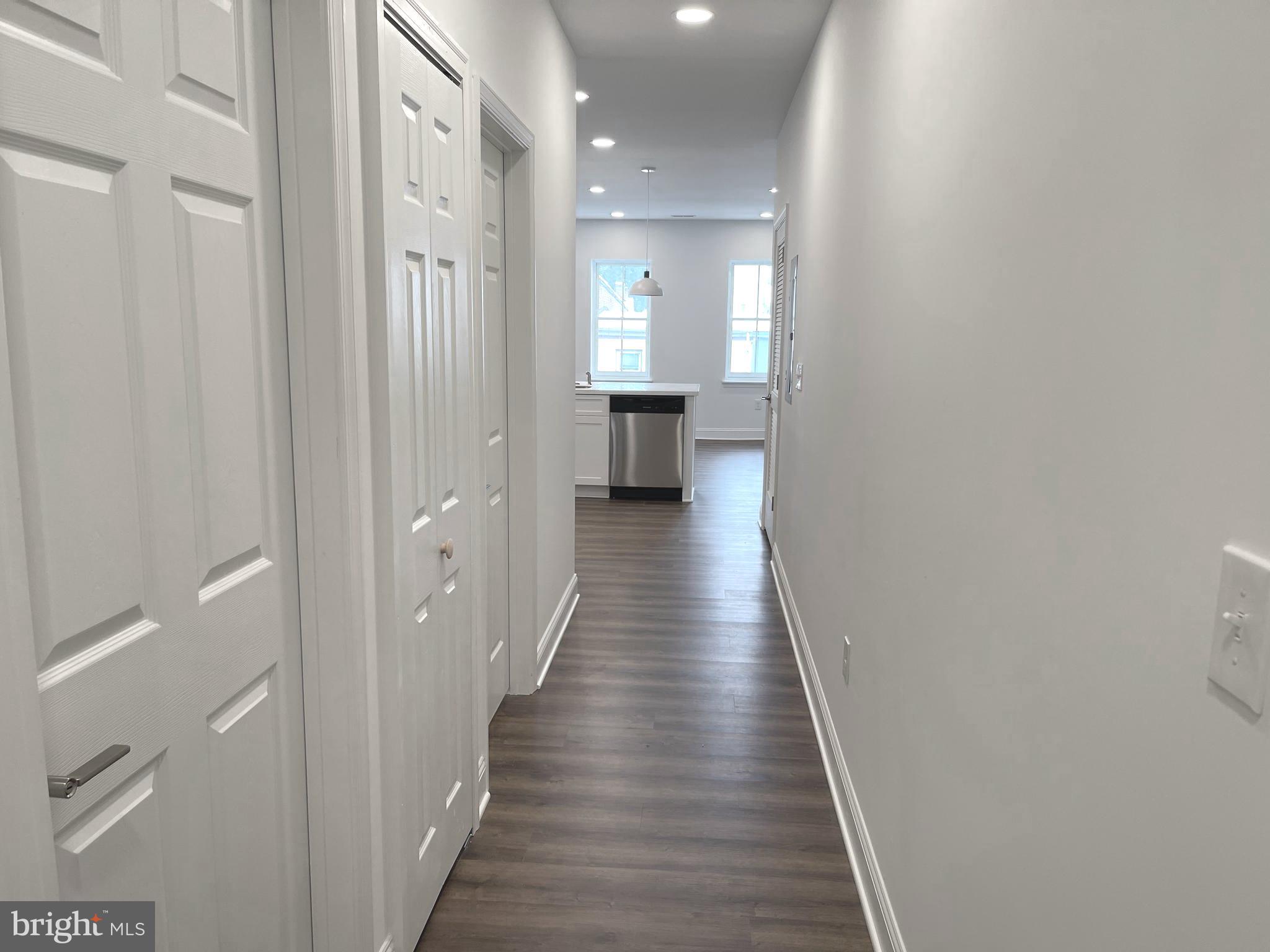 26 South State Street Newtown, PA 18940 - Photo 13 of 20 a view of a hallway with wooden floor