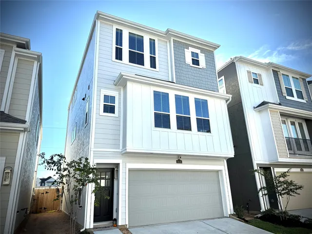 a front view of a house with many windows