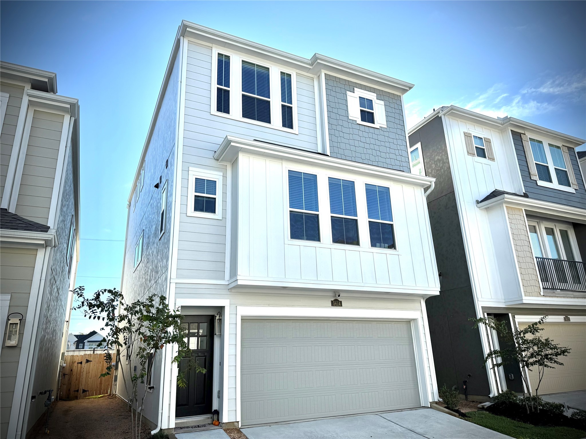 a front view of a house with many windows
