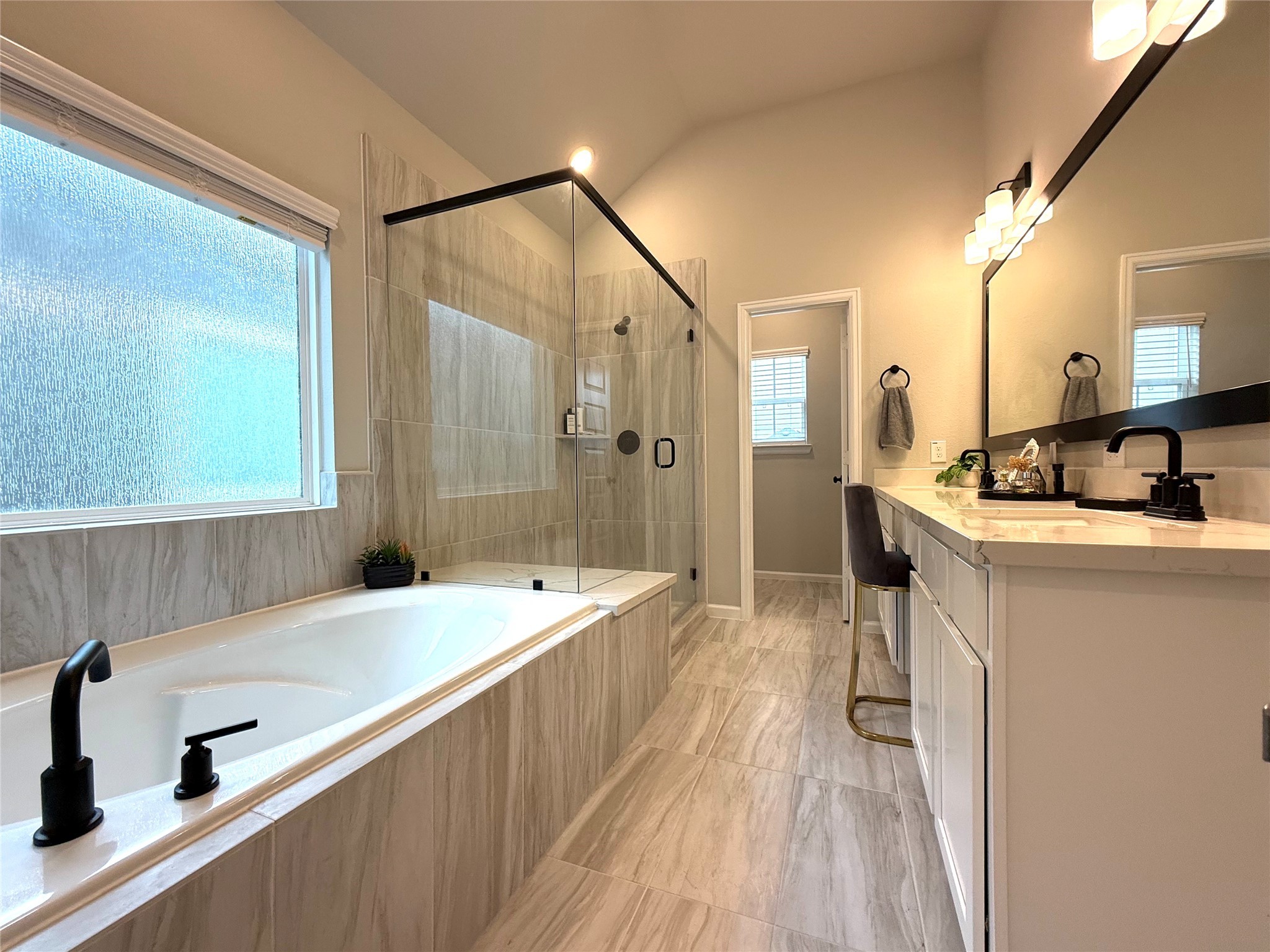 5614 Green Rise Lane Houston, TX 77091 - Photo 13 of 27 a spacious bathroom with a double vanity sink a mirror and shower