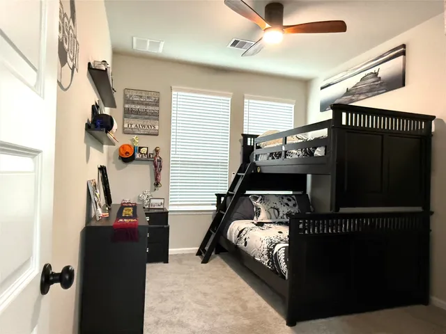 a bedroom with furniture and a window