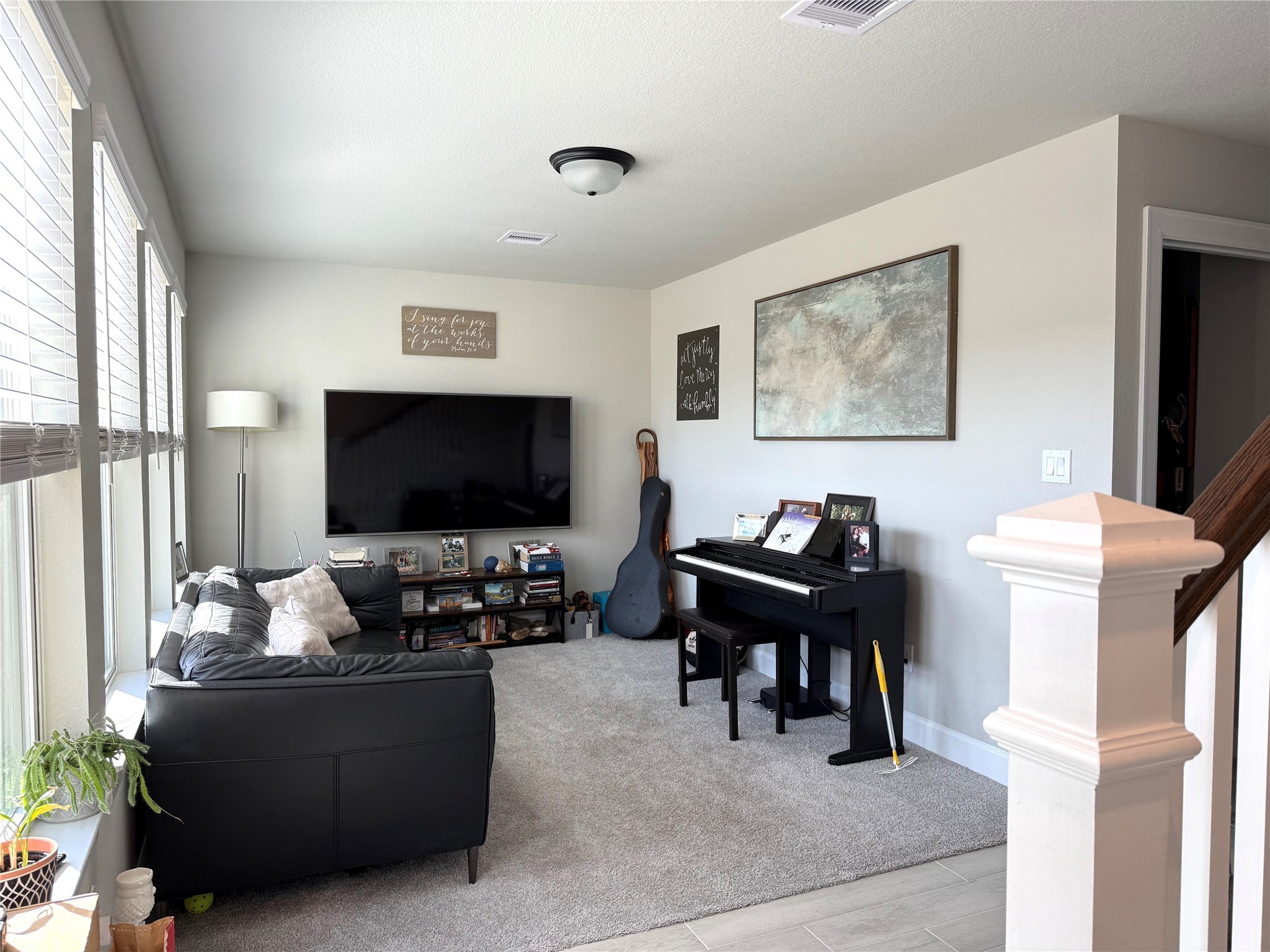 5614 Green Rise Lane Houston, TX 77091 - Photo 19 of 27 a living room with furniture and a flat screen tv