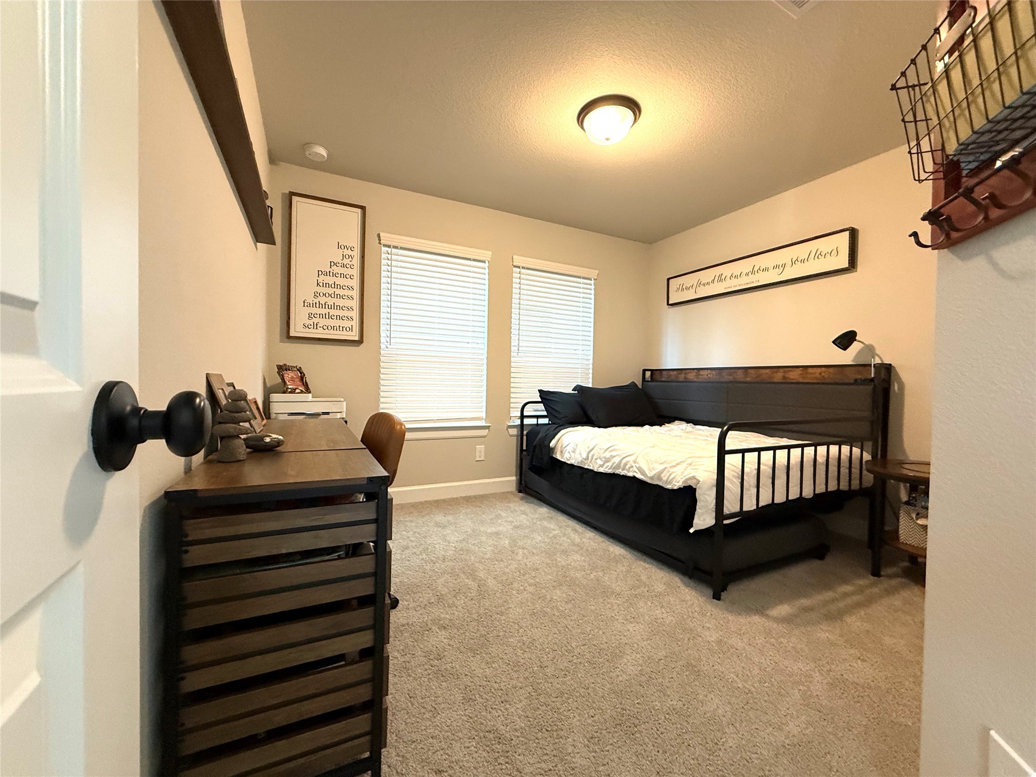 5614 Green Rise Lane Houston, TX 77091 - Photo 20 of 27 a bedroom with a bed and wooden floor