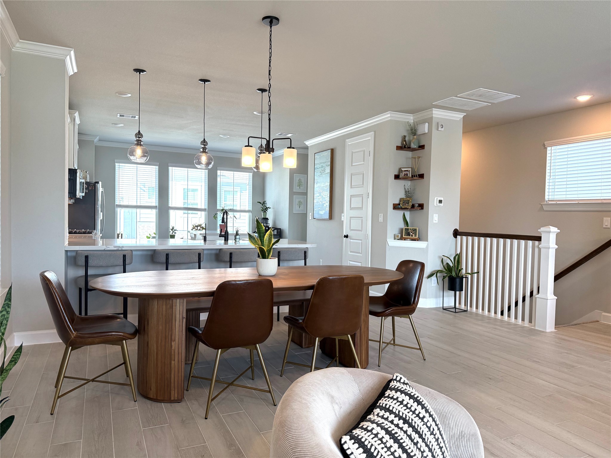 5614 Green Rise Lane Houston, TX 77091 - Photo 3 of 27 a dining room with furniture a chandelier and wooden floor