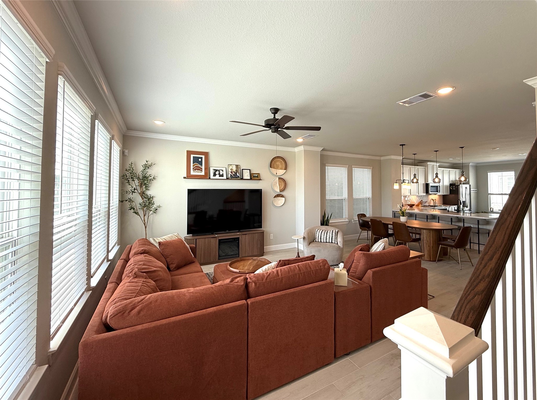 5614 Green Rise Lane Houston, TX 77091 - Photo 10 of 27 a living room with furniture a large window and a flat screen tv