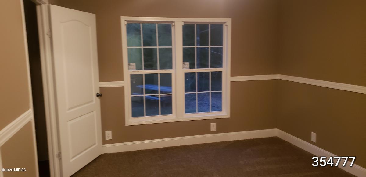 5700 Taylor Road Lizella, GA 31052 - Photo 14 of 23 a view of an empty room with a window