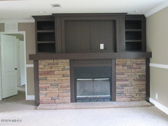 5700 Taylor Road Lizella, GA 31052 - Photo 15 of 23 a living room with a fireplace