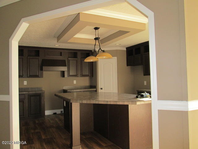 5700 Taylor Road Lizella, GA 31052 - Photo 19 of 23 a kitchen with a sink and a refrigerator