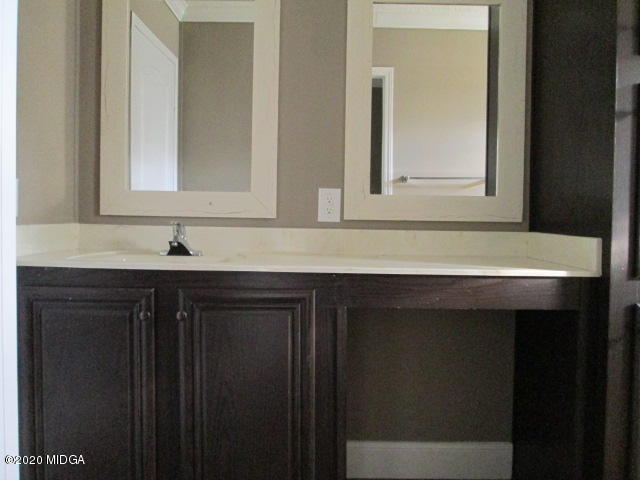 5700 Taylor Road Lizella, GA 31052 - Photo 21 of 23 a bathroom with a sink vanity and mirror