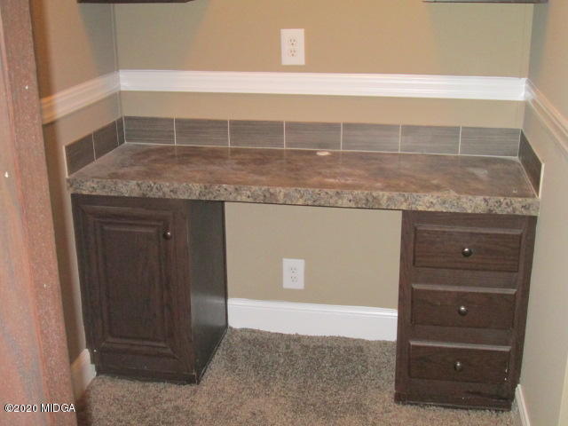 5700 Taylor Road Lizella, GA 31052 - Photo 22 of 23 a bathroom with a granite countertop sink and a mirror
