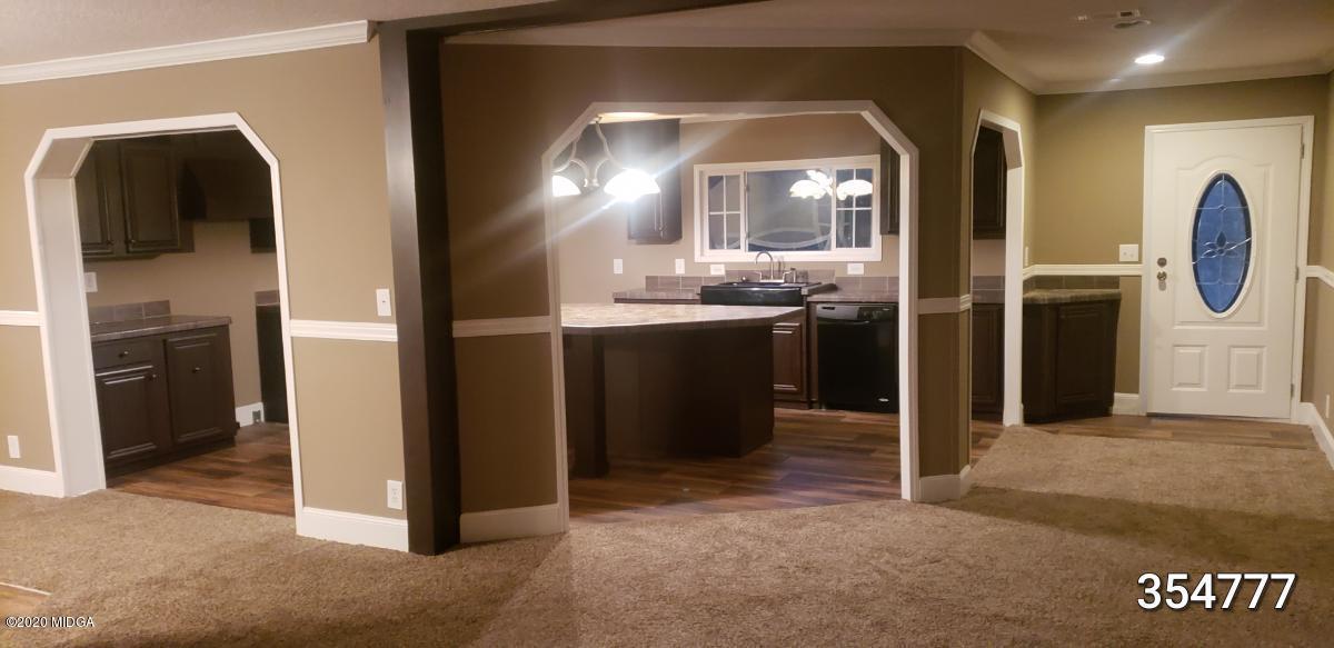 5700 Taylor Road Lizella, GA 31052 - Photo 5 of 23 a view of a kitchen with a refrigerator