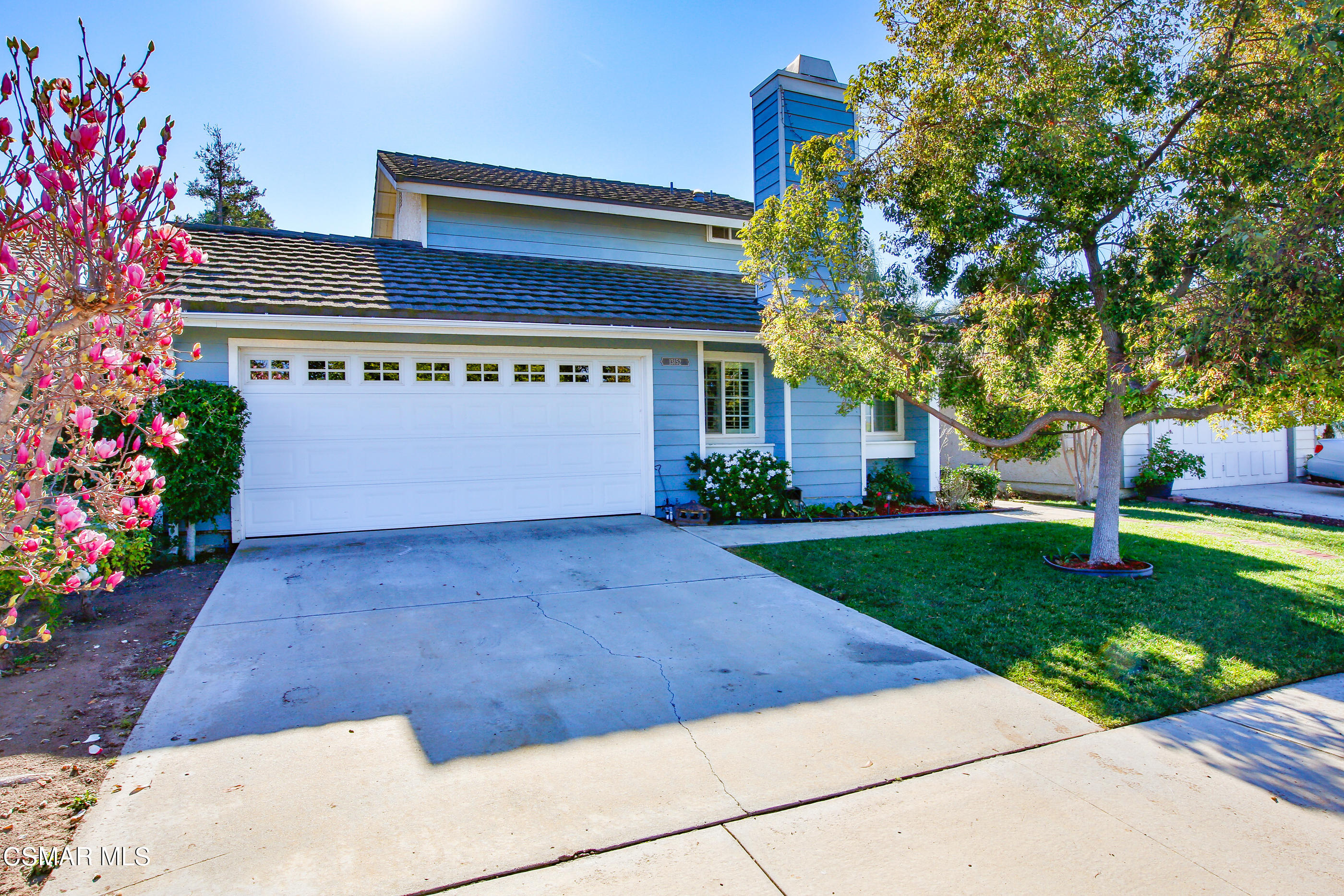 13152 East Millerton Road Moorpark, CA 93021 - Photo 1 of 36 a front view of house with a garden