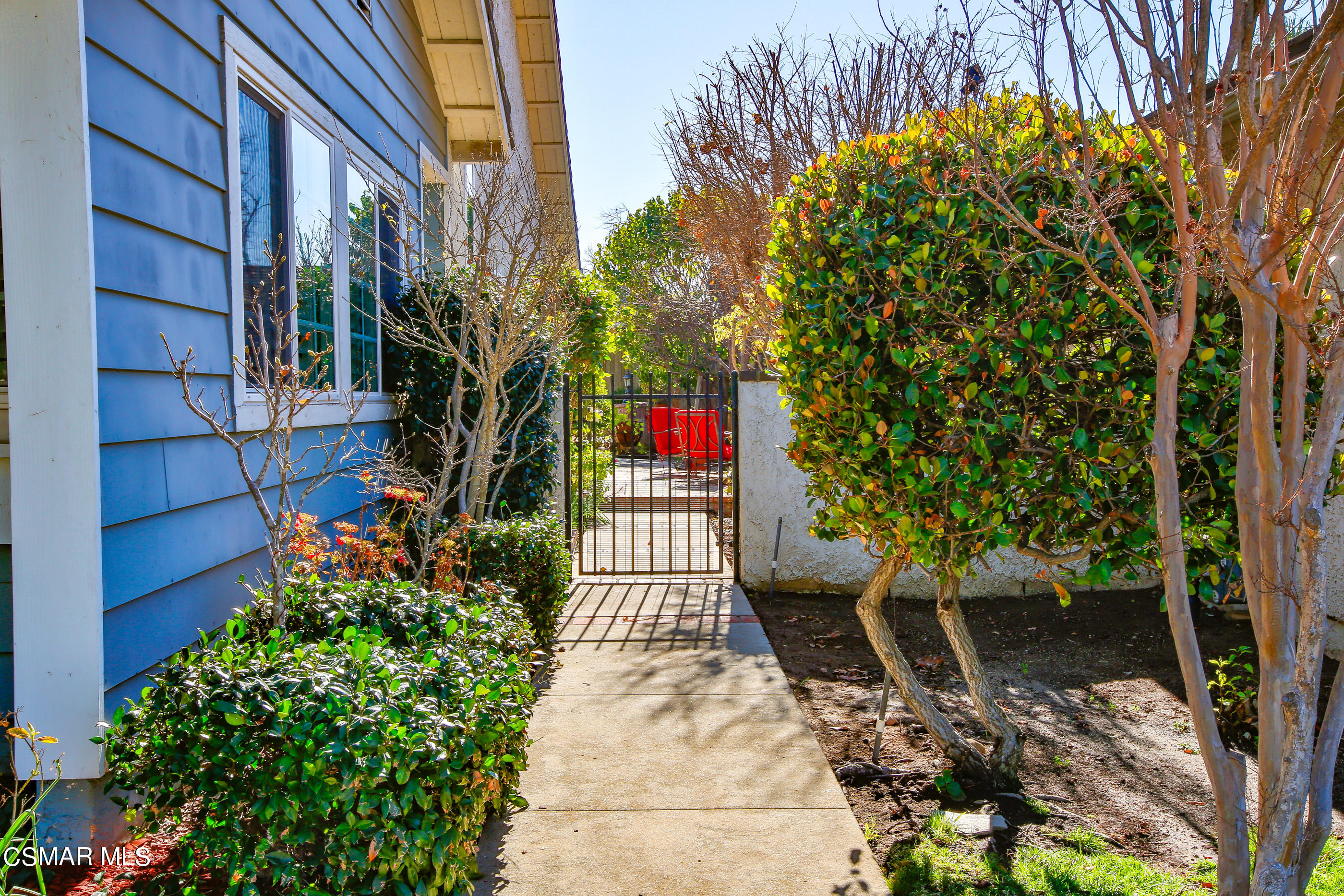 13152 East Millerton Road Moorpark, CA 93021 - Photo 2 of 36 a view of a house with a small yard and large tree