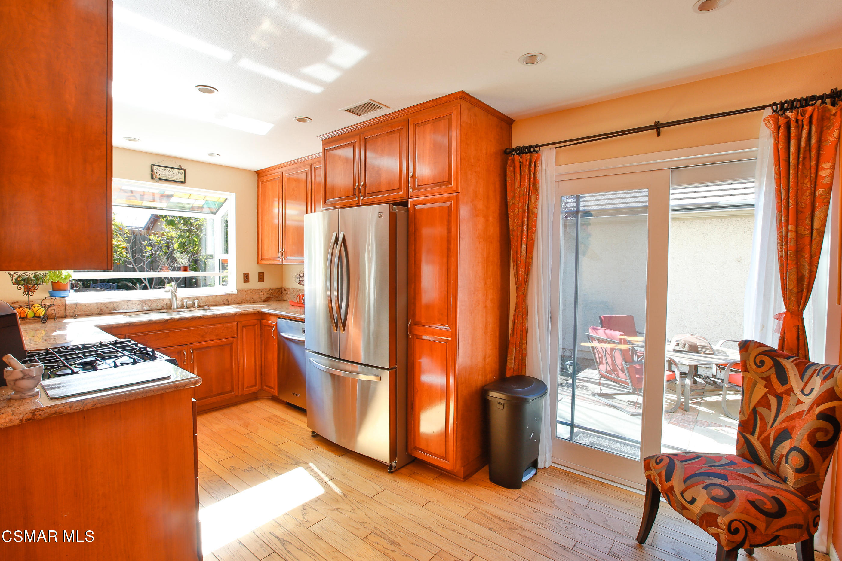 13152 East Millerton Road Moorpark, CA 93021 - Photo 13 of 36 a kitchen with stainless steel appliances granite countertop a refrigerator a stove and a wooden floors