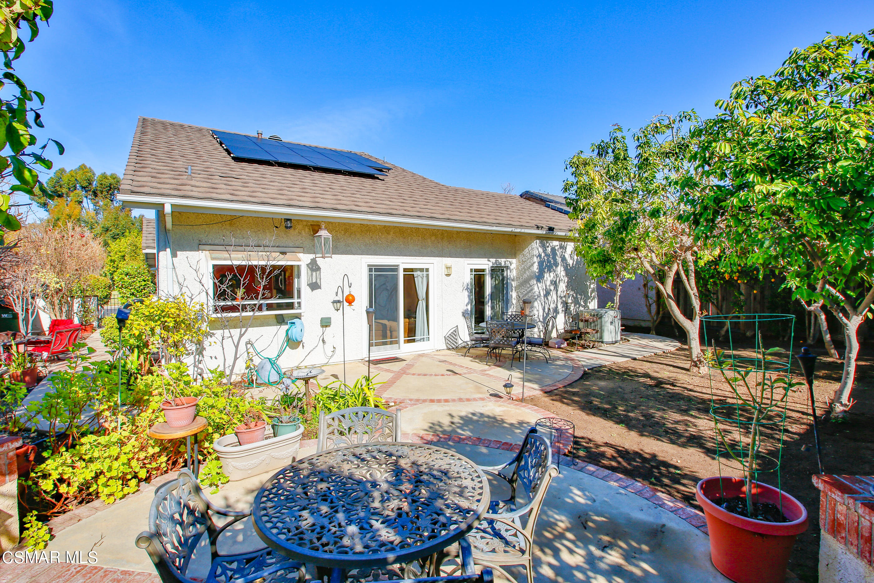 13152 East Millerton Road Moorpark, CA 93021 - Photo 30 of 36 a view of a house with backyard and sitting area