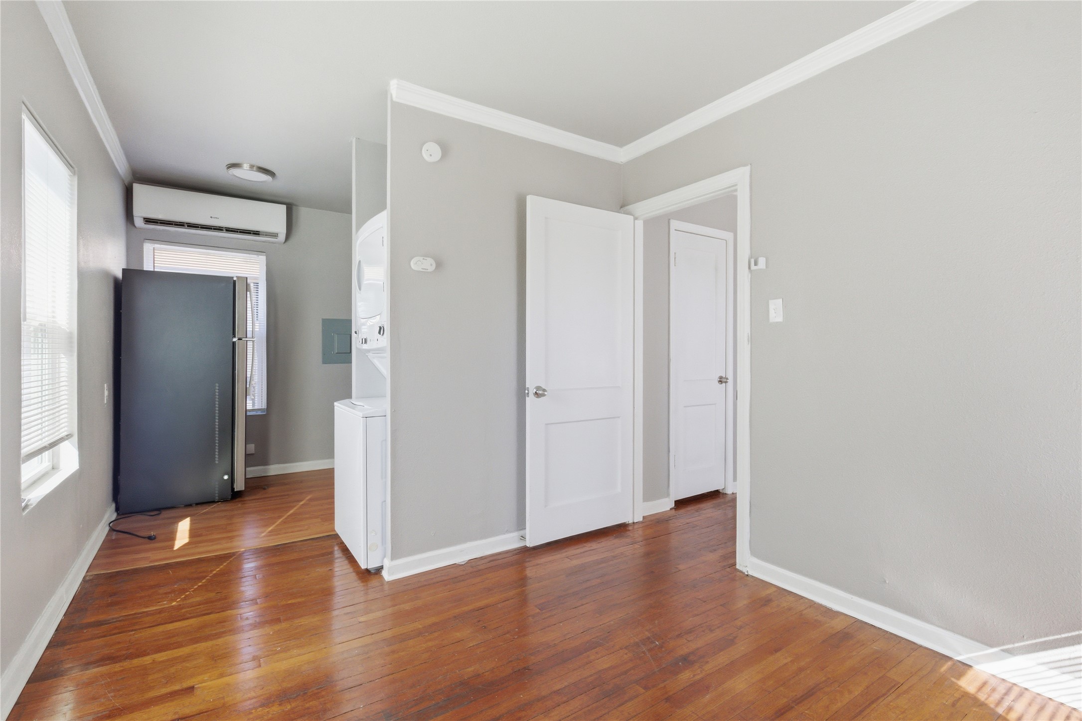 204 East 30th Street, Unit 201 Austin, TX 78705 - Photo 7 of 18 a view of hallway with wooden floor
