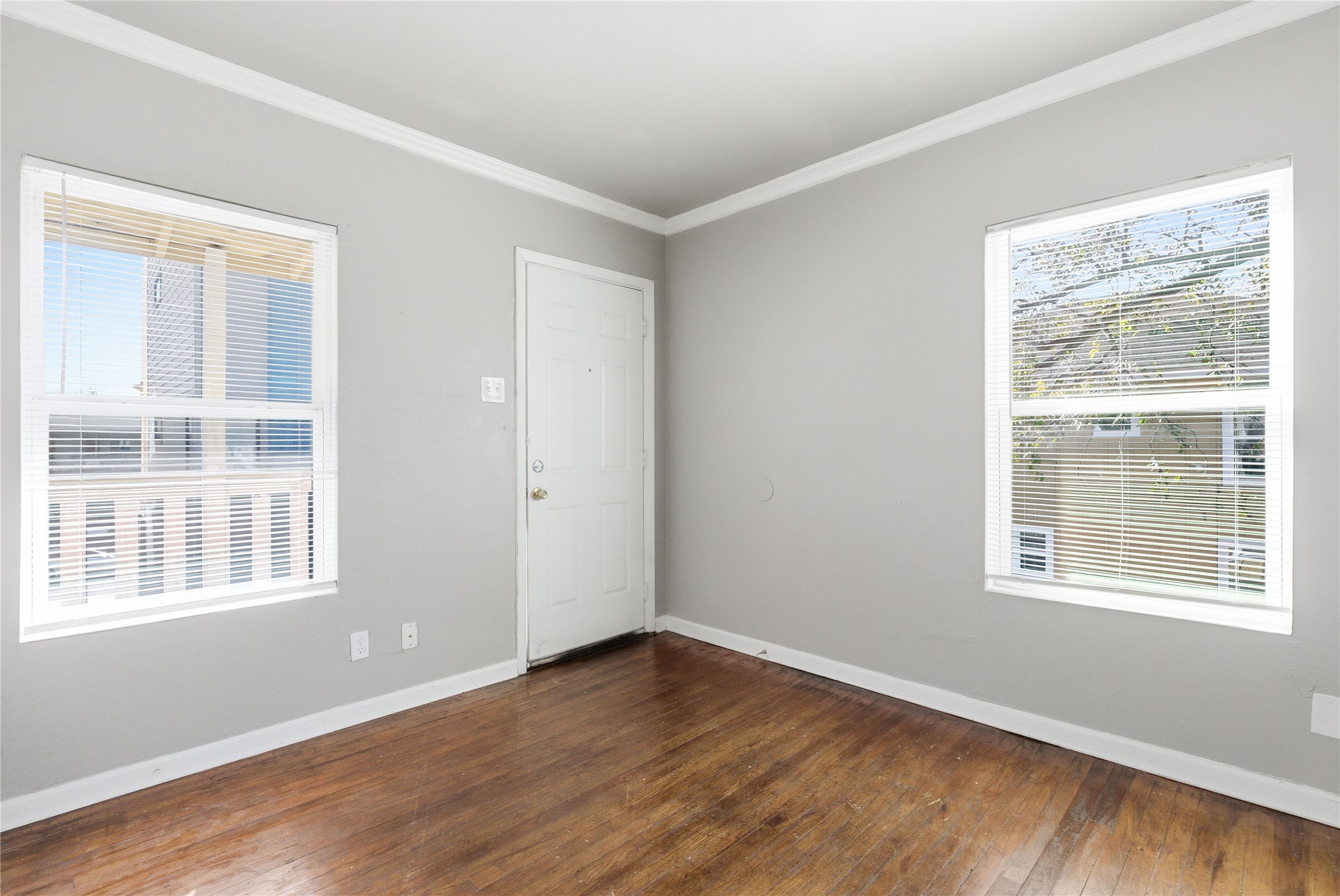 204 East 30th Street, Unit 201 Austin, TX 78705 - Photo 9 of 18 a view of an empty room with wooden floor and a window