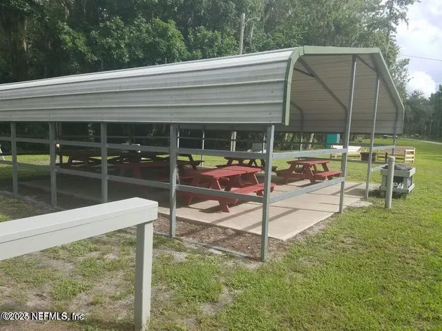 a patio with table and chairs