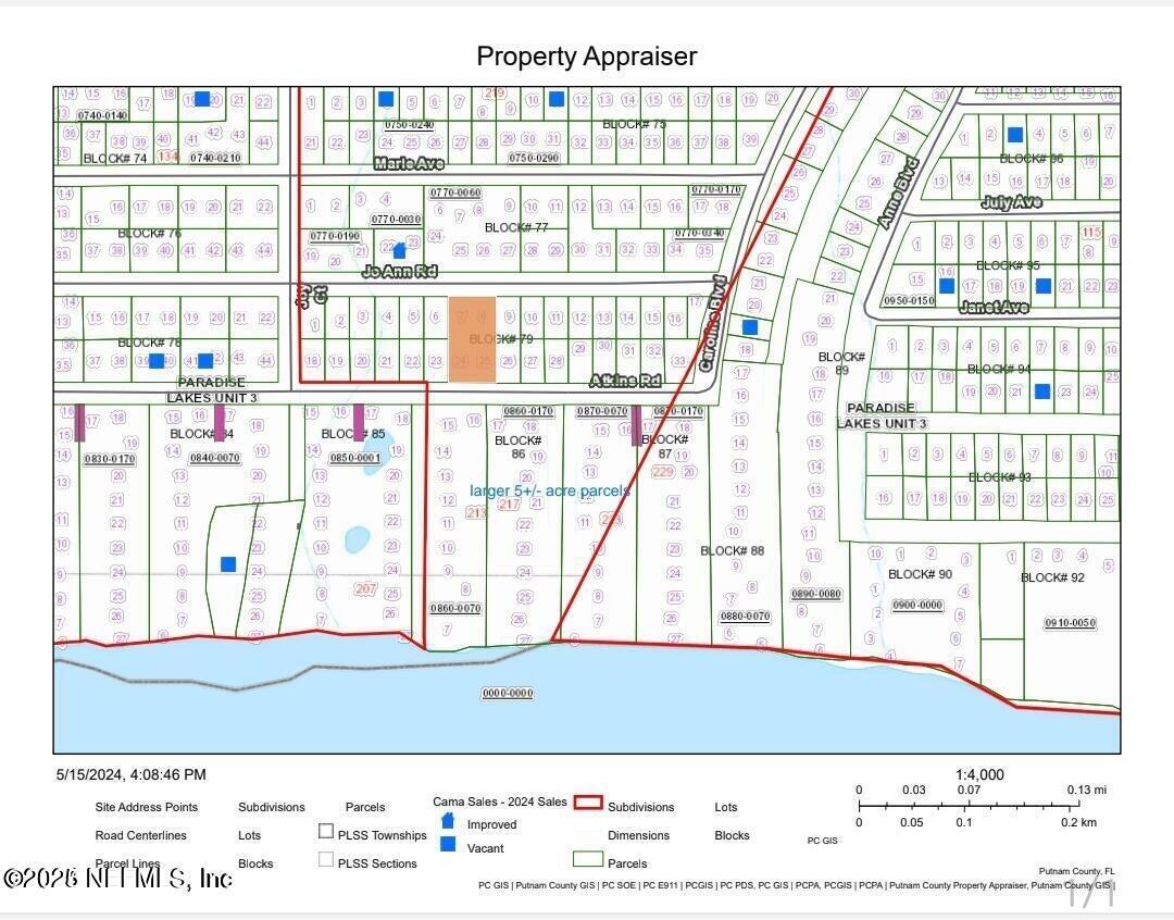 212 Atkins Road Georgetown, FL 32139 - Photo 20 of 20 a view of a large building with a lake view
