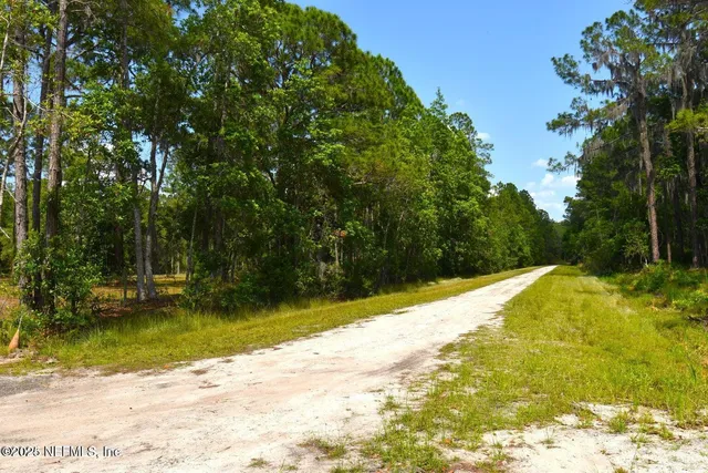 a view of a swimming pool with an outdoor space and seating area