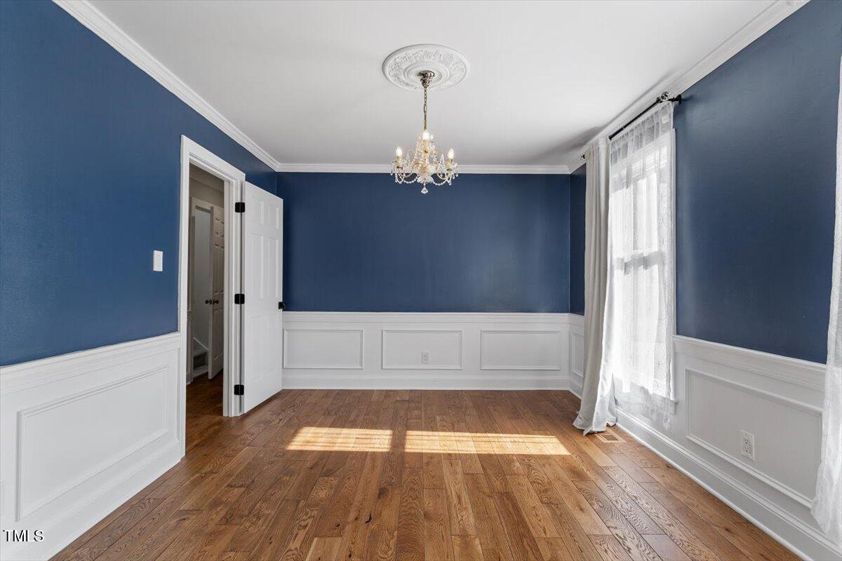 7209 Halstead Lane Raleigh, NC 27613 - Photo 13 of 64 a view of wooden floor and staircase