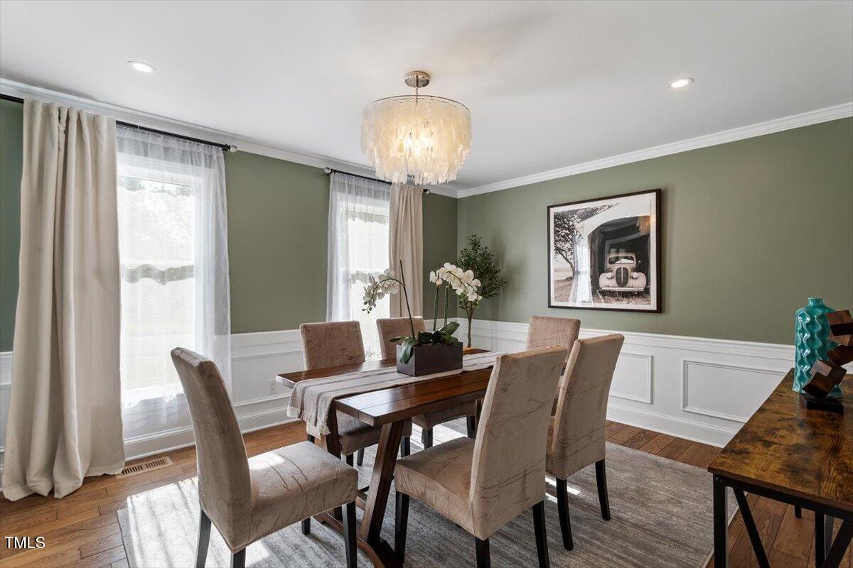 7209 Halstead Lane Raleigh, NC 27613 - Photo 16 of 64 a view of a dining room with furniture window and wooden floor