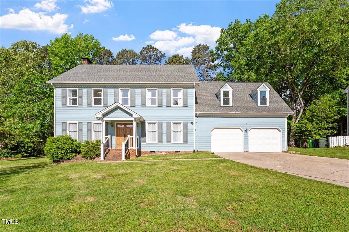 7209 Halstead Lane Raleigh, NC 27613 - Photo 2 of 64 a front view of a house with a yard