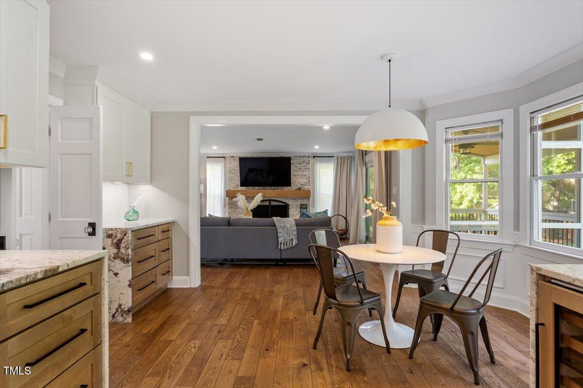 7209 Halstead Lane Raleigh, NC 27613 - Photo 33 of 64 a view of a dining room with furniture window and wooden floor