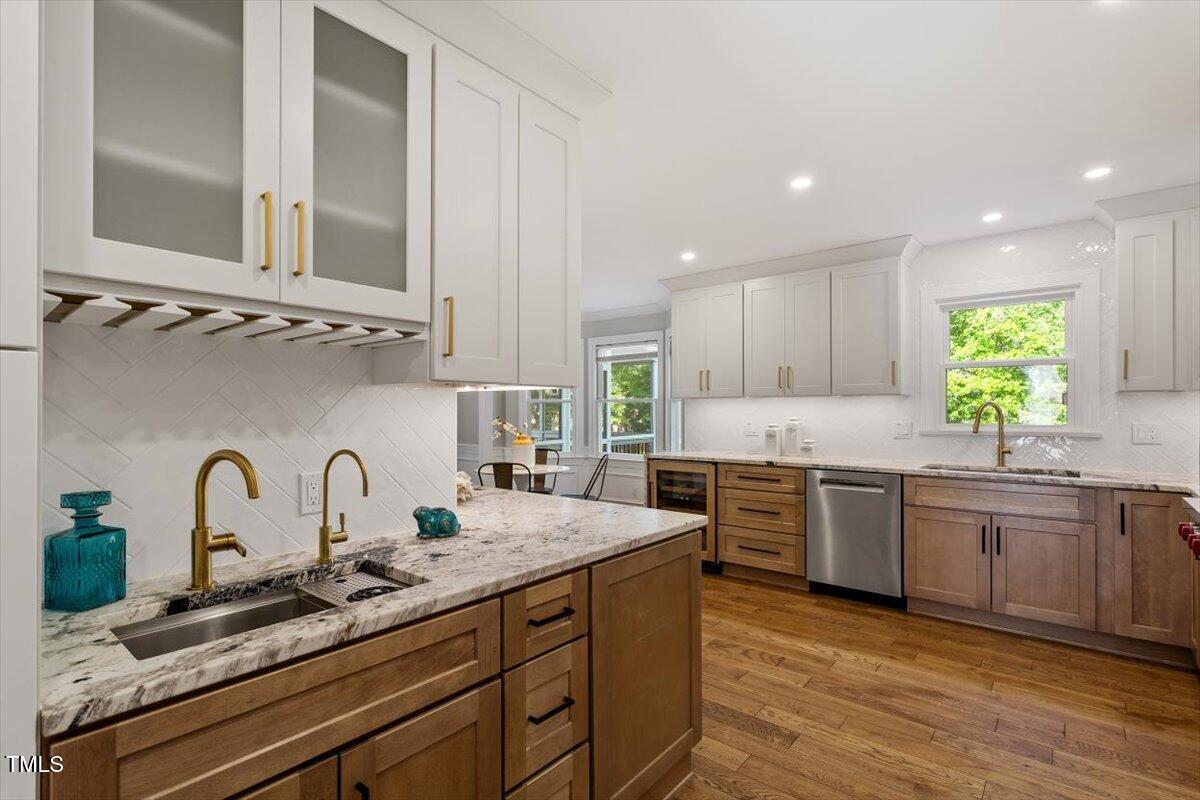 7209 Halstead Lane Raleigh, NC 27613 - Photo 34 of 64 a kitchen with sink stove and cabinets