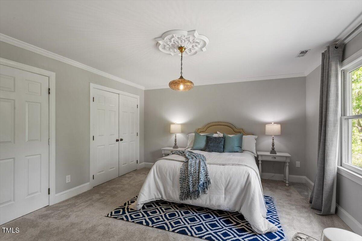 7209 Halstead Lane Raleigh, NC 27613 - Photo 40 of 64 a bedroom with a bed and window
